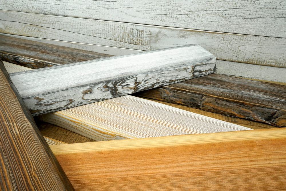 Druck auf Holzbalken